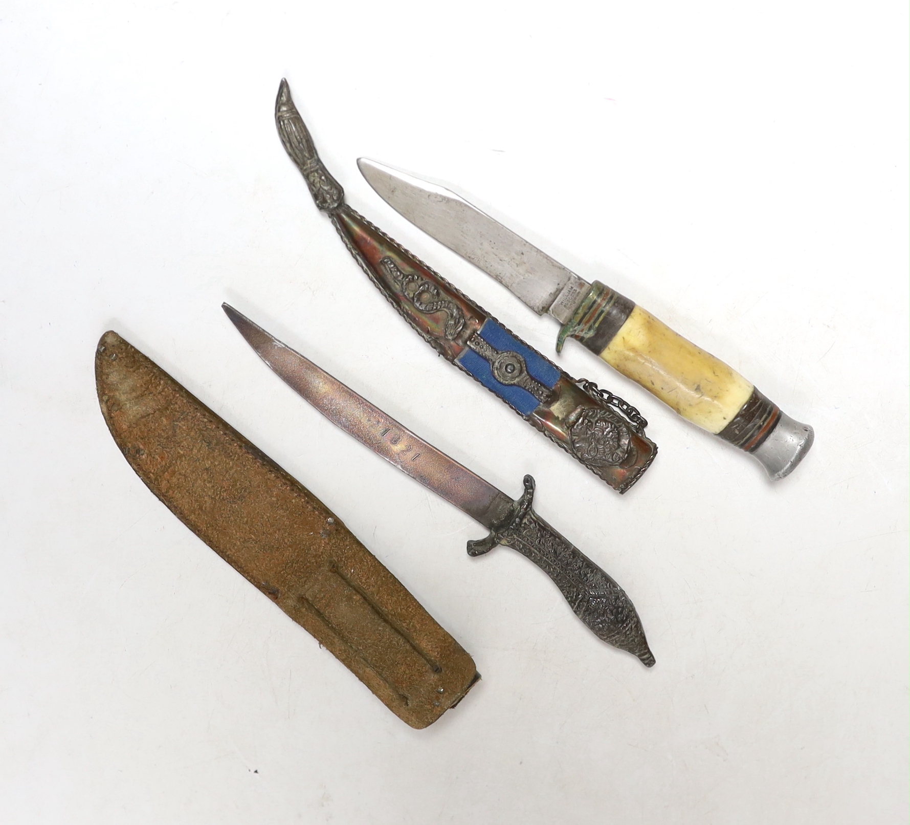 A William Roger’s stag antler handled dagger with leather sheathe and another dagger, blade stamped 1821